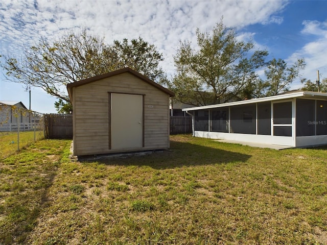 exterior space featuring a shed and a yard