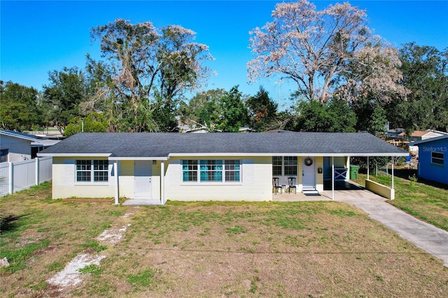 single story home with a carport and a front yard