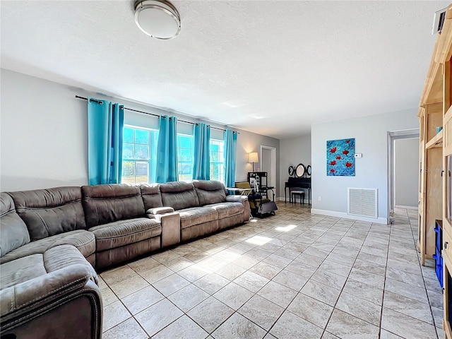 living room featuring a textured ceiling