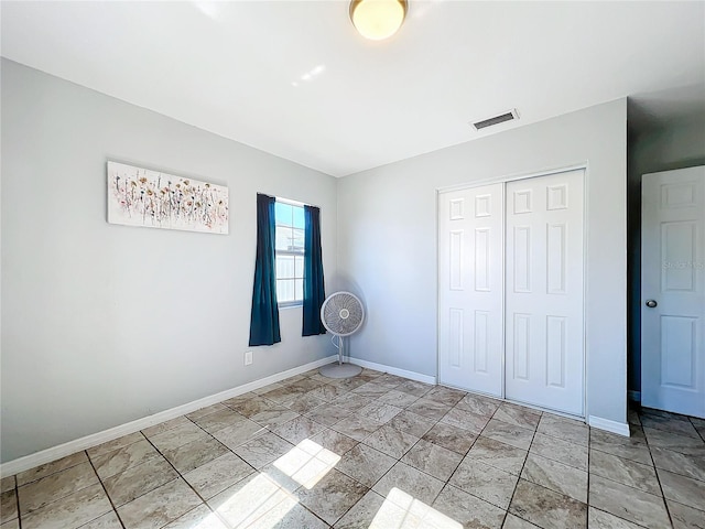 unfurnished bedroom with a closet