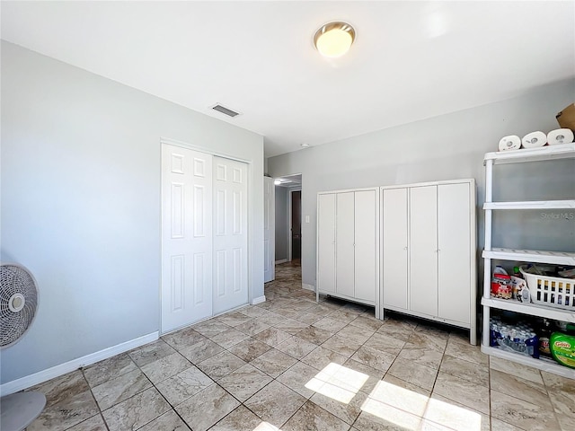 unfurnished bedroom featuring multiple closets