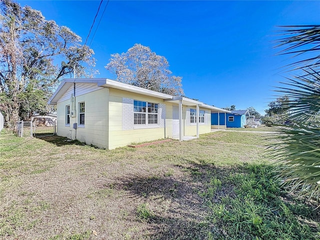 back of house with a yard