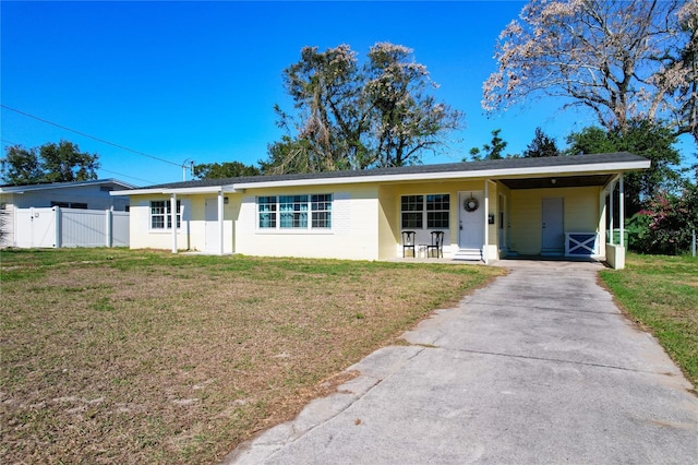 single story home with a front yard and a carport