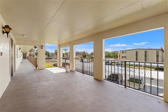 view of patio featuring a balcony