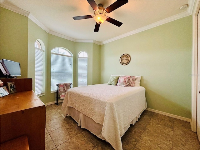 bedroom with ceiling fan and ornamental molding