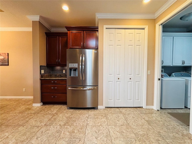 kitchen featuring tasteful backsplash, stainless steel fridge with ice dispenser, crown molding, and washer and dryer