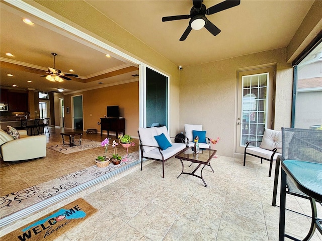 view of patio / terrace featuring ceiling fan