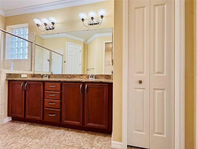 bathroom with ornamental molding, vanity, and a shower with shower door