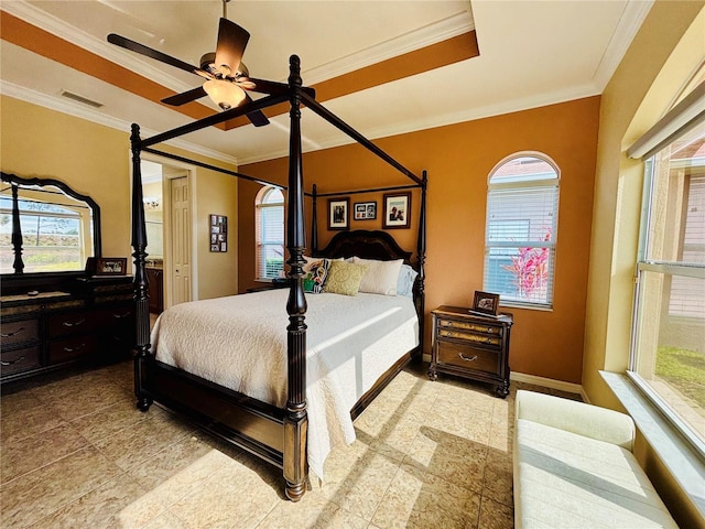 bedroom featuring a raised ceiling, ceiling fan, and crown molding