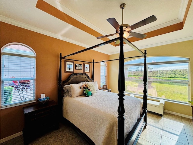 bedroom featuring tile patterned floors, ceiling fan, ornamental molding, and multiple windows