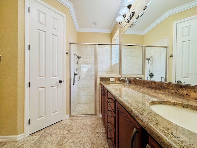 bathroom with vanity, a shower with door, and ornamental molding