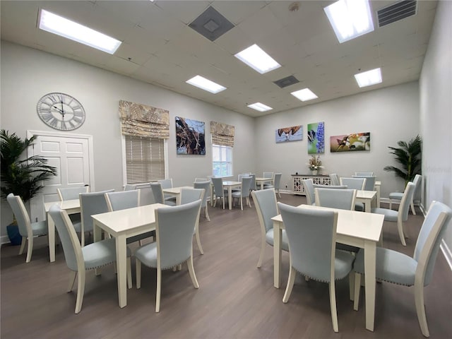 dining area with dark hardwood / wood-style floors