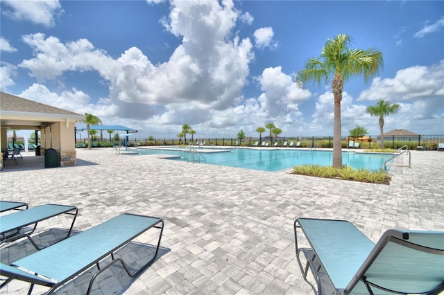 view of swimming pool with a patio area