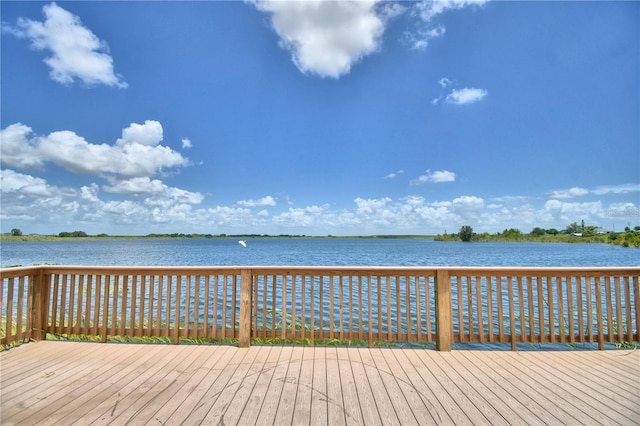 wooden terrace with a water view