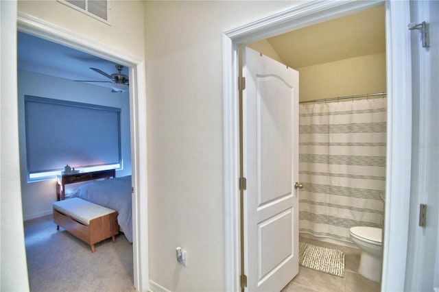 bathroom featuring toilet and tile patterned floors