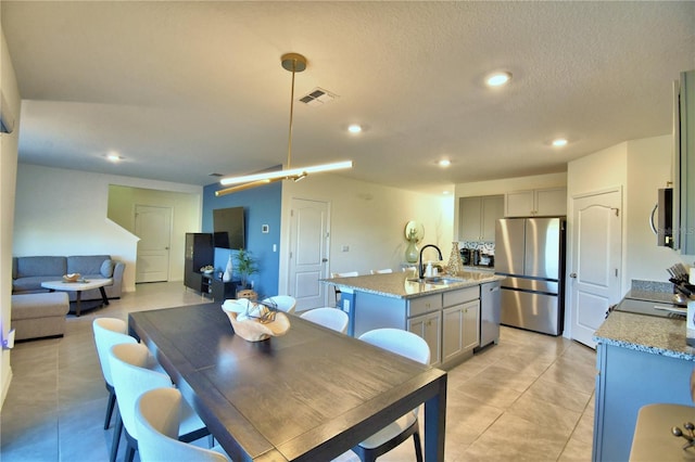 tiled dining room with sink