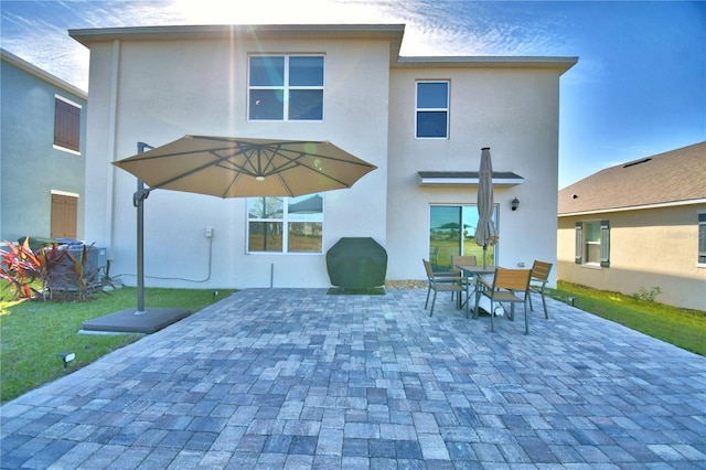 rear view of house with a patio area