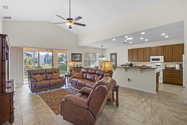 living area with high vaulted ceiling, recessed lighting, visible vents, and ceiling fan