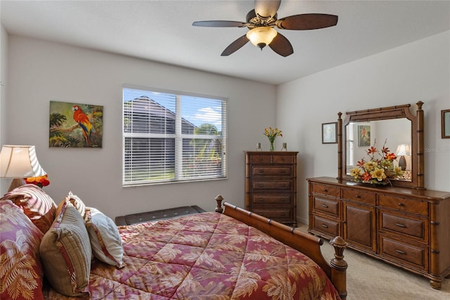 bedroom featuring light carpet and ceiling fan