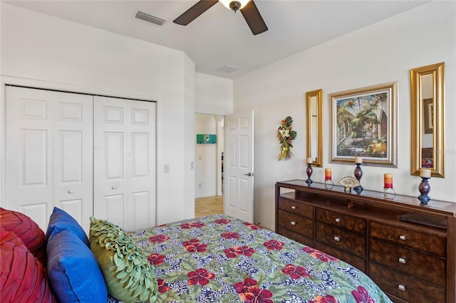 bedroom featuring ceiling fan, a closet, and visible vents