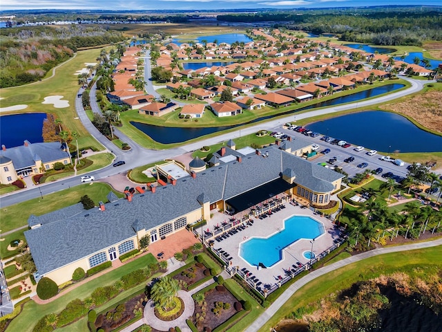 bird's eye view featuring a water view and a residential view