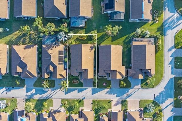 birds eye view of property with a residential view