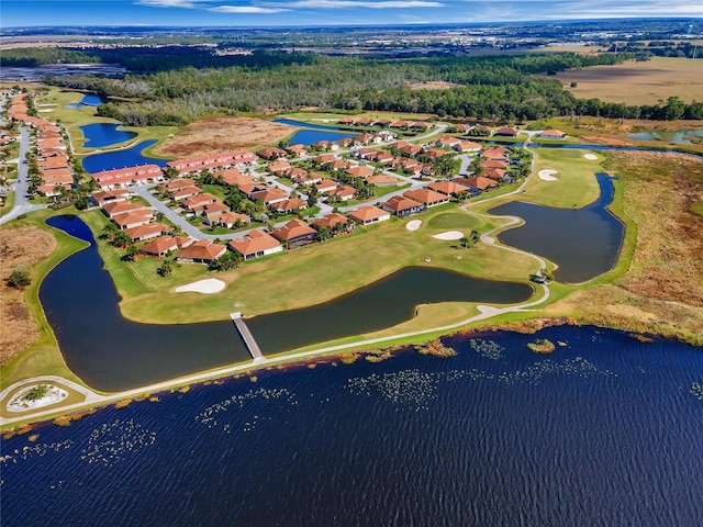 aerial view featuring view of golf course, a water view, and a residential view