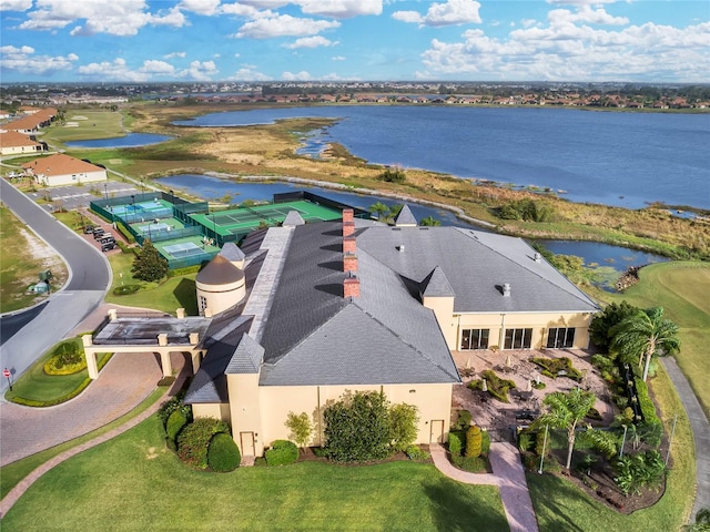 birds eye view of property with a water view