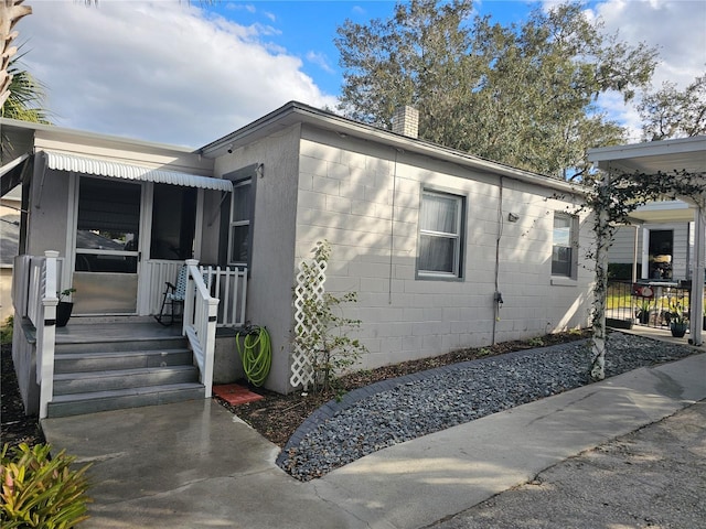 view of home's exterior with covered porch