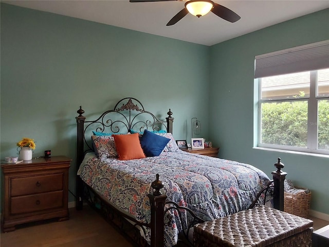 bedroom featuring ceiling fan and hardwood / wood-style floors