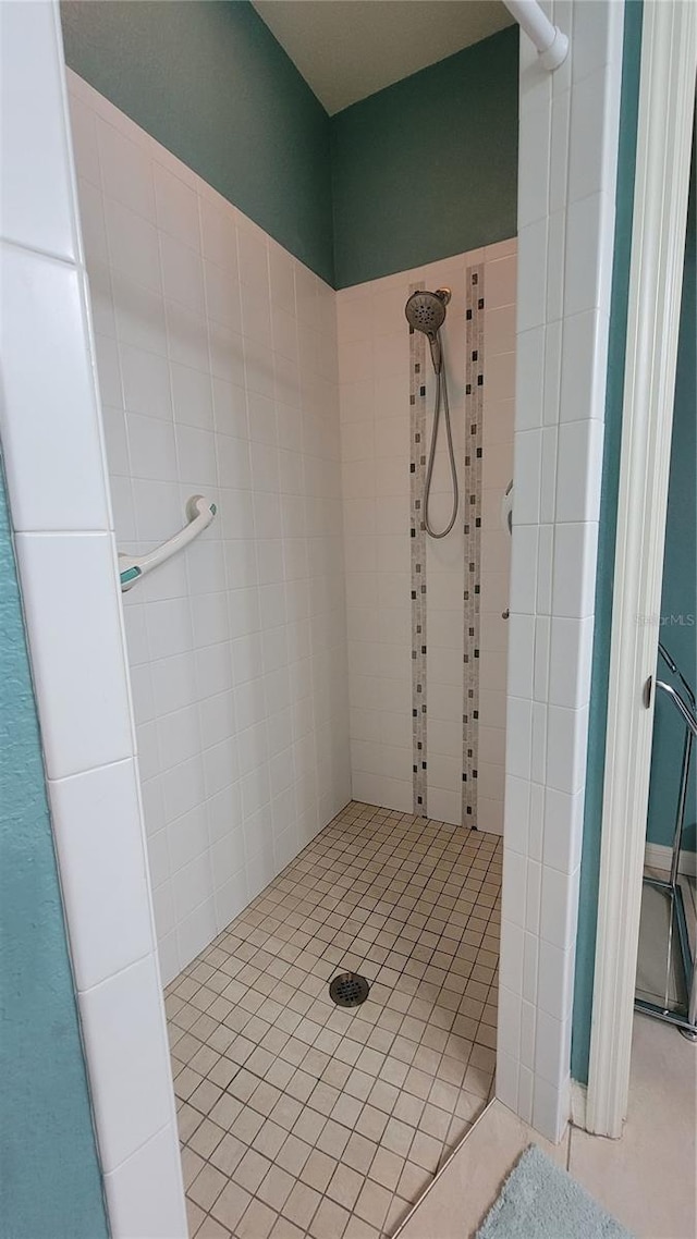 bathroom with a tile shower