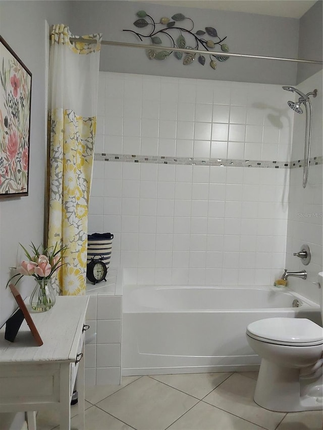 bathroom featuring tile patterned flooring, shower / tub combo, and toilet