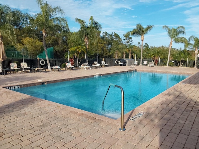 view of swimming pool with a patio