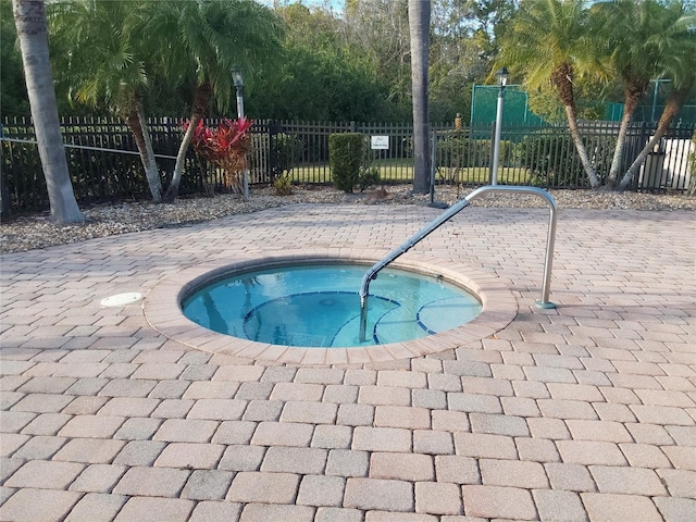 view of pool featuring a patio area and a community hot tub