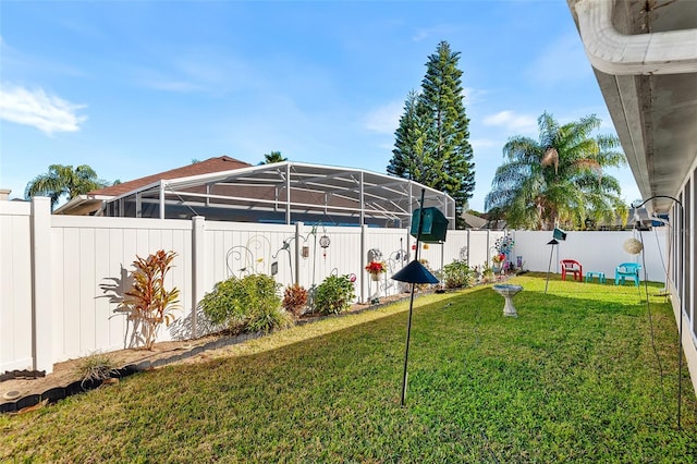 view of yard featuring glass enclosure