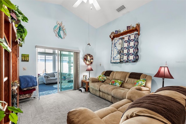 carpeted living room with ceiling fan and lofted ceiling