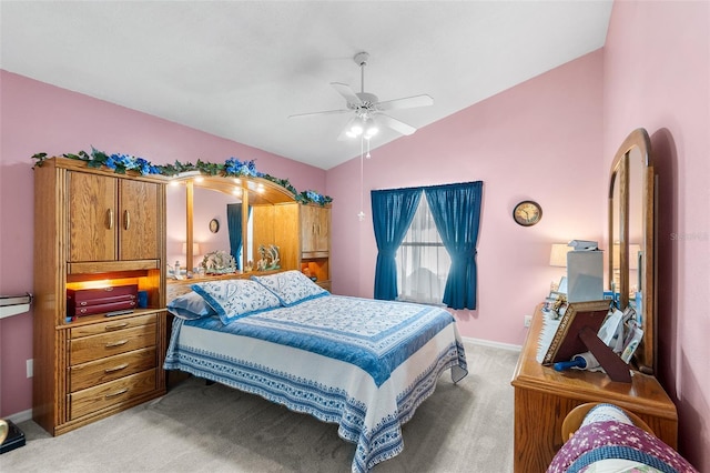 bedroom featuring ceiling fan, light carpet, and lofted ceiling