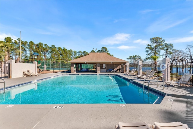 view of swimming pool with a gazebo and a patio area