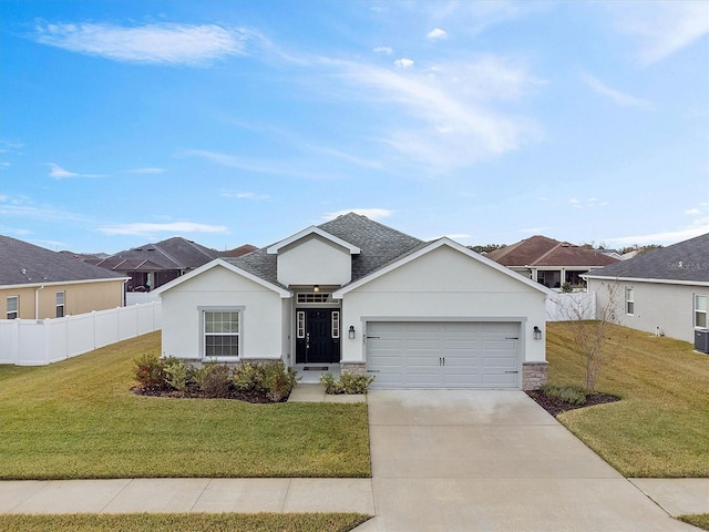 view of front of property with a garage and a front yard