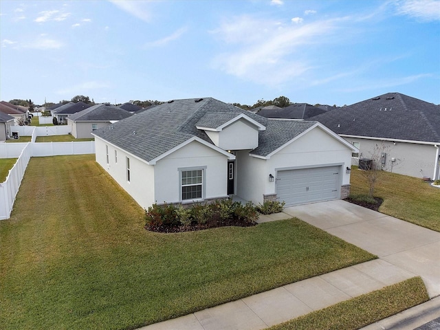 ranch-style home with a front yard and a garage