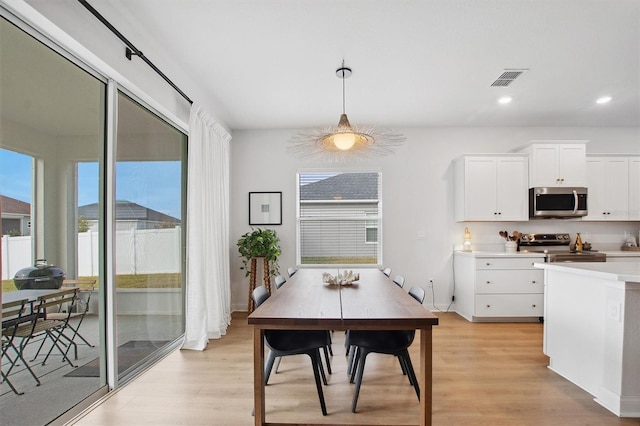 dining room featuring light wood-type flooring