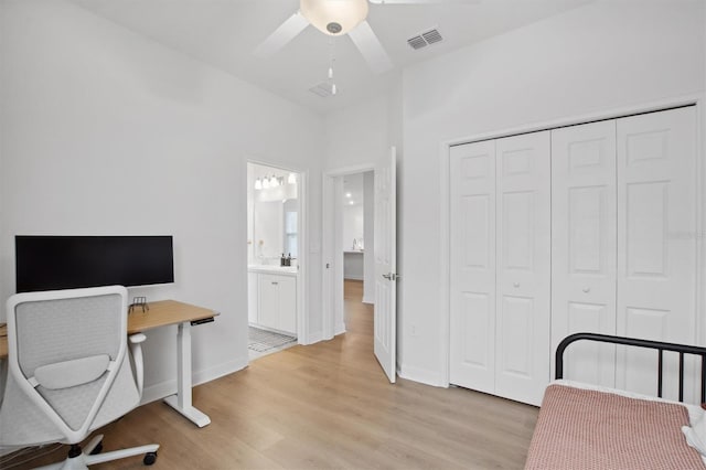 office space featuring ceiling fan and light wood-type flooring