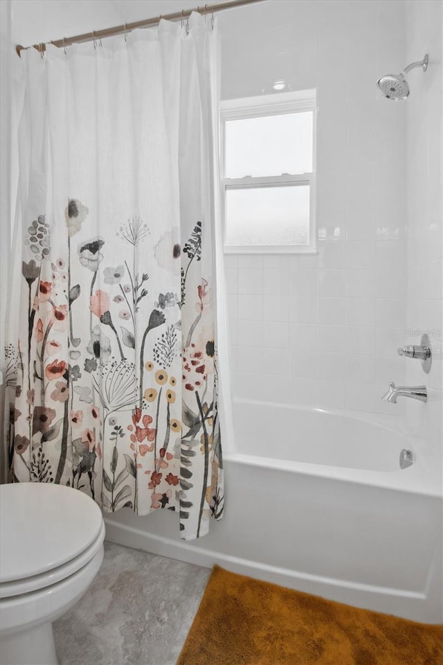 bathroom featuring toilet and shower / bath combo with shower curtain