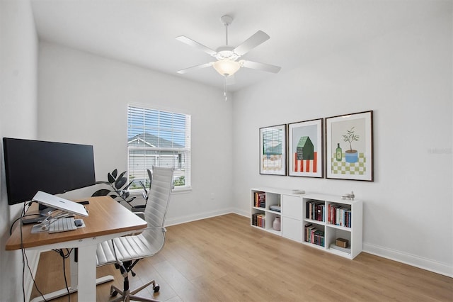 office area with light wood-type flooring and ceiling fan