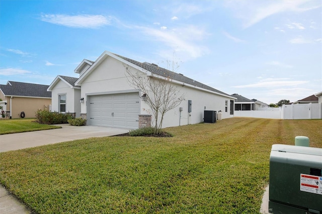 view of home's exterior with a lawn, central AC unit, and a garage