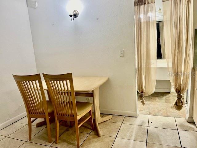 dining room with light tile patterned floors