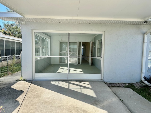 doorway to property featuring a patio area