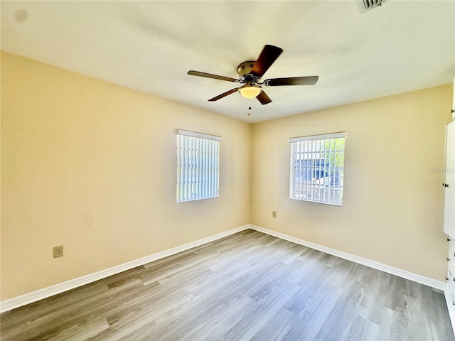 unfurnished room featuring ceiling fan and light hardwood / wood-style floors