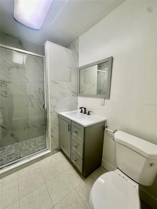 bathroom featuring toilet, vanity, and walk in shower