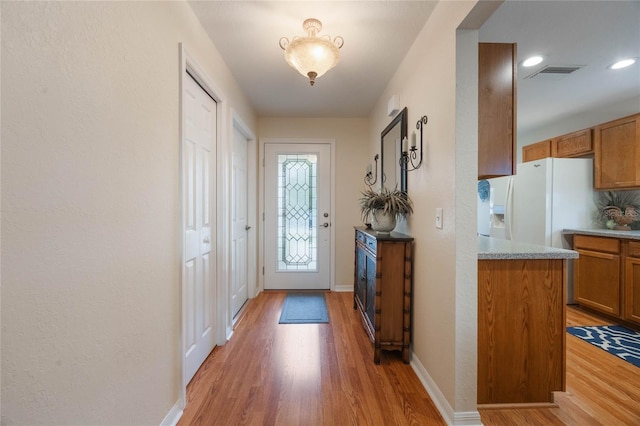 doorway with wood-type flooring